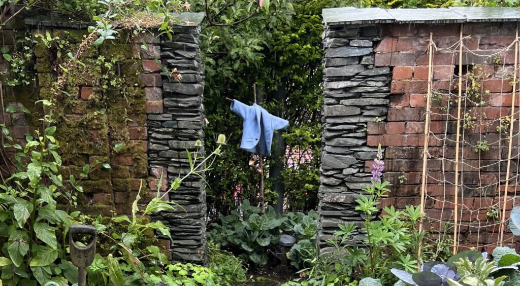 A picture of Peter Rabbit's famous blue jacket. In the garden of the World of Beatrix Potter in Bowness on Windermere. 