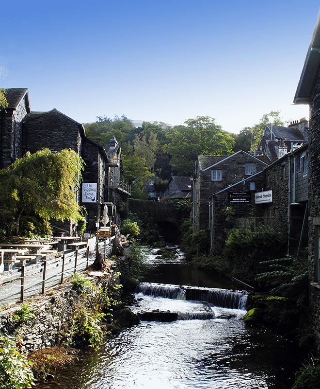 A picture looking up Stock Beck in Ambleside with the Old Mill on the right.